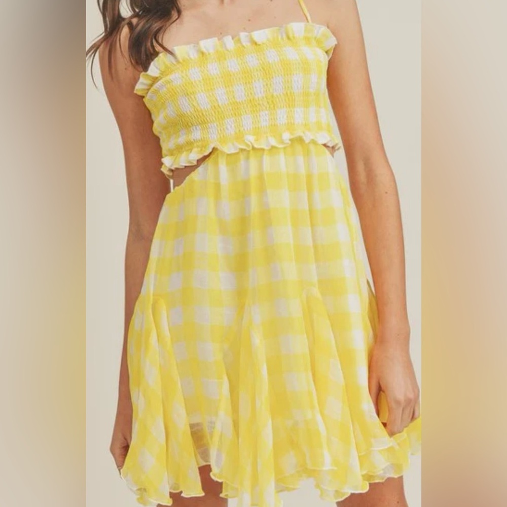 The cutest yellow mini dress! Brand new with tangs! So cute!